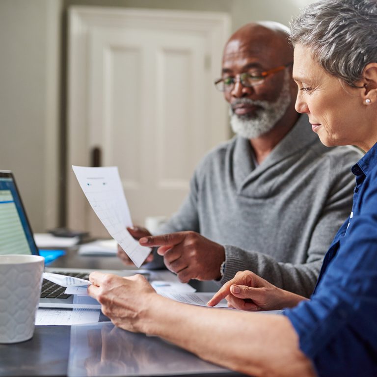 Laptop, documents and finance with a senior couple busy on a bud